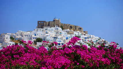 Picturesque castle of Astypalaia island as seen through beautiful bougainvillea in blossom, Dodecanese, Greece