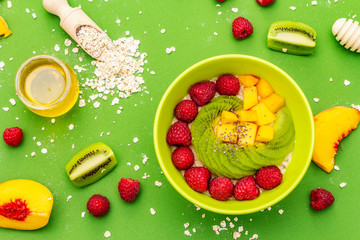 Oatmeal bowl with fresh berries and fruits