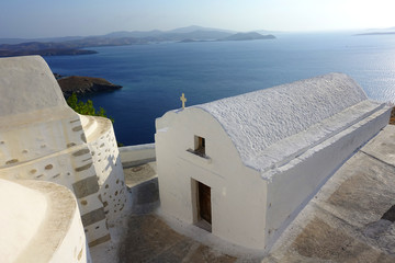 Picturesque small chapels below iconic castle of Astypalaia island with views to the Aegean deep blue sea