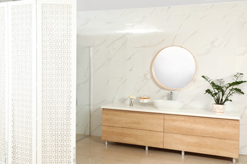 Fototapeta na wymiar Modern bathroom interior with shower stall and folding screen