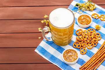 Oktoberfest set. Light beer, pretzels, mustard, sesame straw, hop.