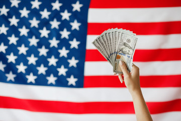 Female hand holding  money. Close-up Hands with American dollars. Business concept