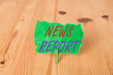 Text sign showing News Report. Business photo showcasing spoken or written account of something that one has observed Empty reminder wooden floor background green clothespin groove slot office