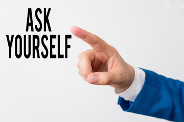 Writing note showing Ask Yourself. Business concept for Thinking the future Meaning and Purpose of Life Goals Isolated hand pointing with finger. Business concept pointing finger