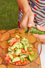 Preparation of salad of fresh vegetables and herbs
