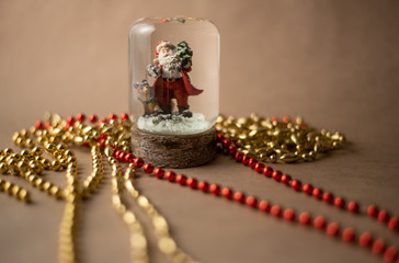 Santa Claus in a glass ball. Christmas mood. Greeting card.