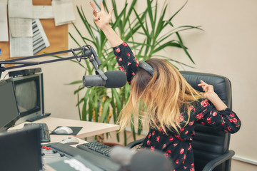 Radio DJ has fun in the studio