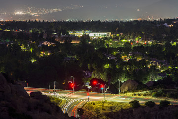 Night view of Topanga Canyon Blvd at Santa Susana Pass Road in the San Fernando Valley area of Los Angeles, California.  