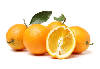 orange fruit with leaves on white background.