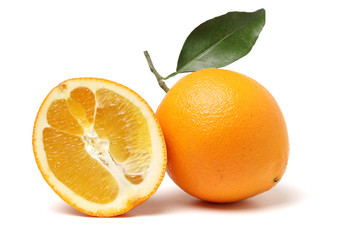orange fruit with leaves on white background.