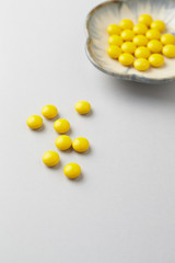 Vitamin C tablets. Bright background. Close up. Copy space.  
