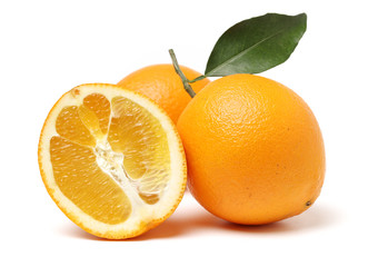orange fruit with leaves on white background.