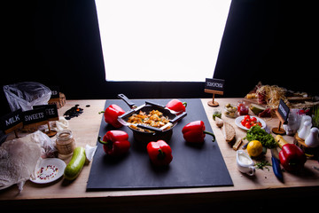 Fried meat in a frying pan closeup. Top view with copy space