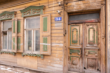 Old house. Private house on the old street in Tver. Wooden windows and door with peeling paint.