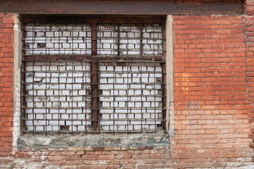 A bricked-up window. Immured window in the pre-revolutionary building in Tver.