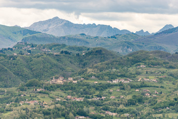 Tuscany. A village in a valley near the town of Barga. View from Barga Cathedral.