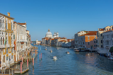  Beautiful Venetian view with Grand Canal, Basilica Santa Maria della Salute and traditional gondolas, in Venice, Italy