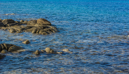 blue water wavy surface simple nature scenic view background with picturesque stone wallpaper poster picture empty copy space 