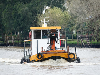 Excavator crane boat at the Delta river, Buenos Aires, Argentina