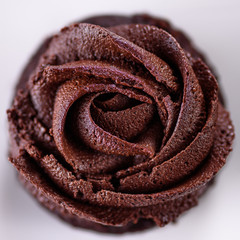 Chocolate cupcakes with various flavours of whipped cream