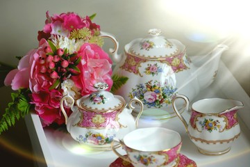 British afternoon tea set and flowers on table