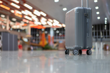 luggage holder on suitcase or bag with TRAVEL INSURANCE ,traveling luggages in an airport terminal,before passenger  and plane flying over sky,Can be used for montage or display your products