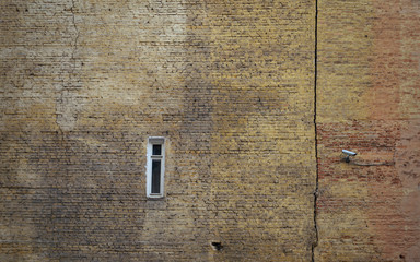 Outside brick wall of an old building constructed in the beginning of last century. Kyiv. Ukraine.