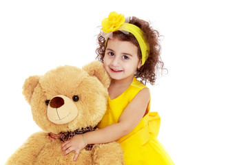 Little girl with teddy bear.Isolated on white background.