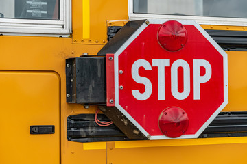 Stop arm on a school bus landscape