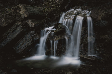 Small waterfall  streaming on the rocks