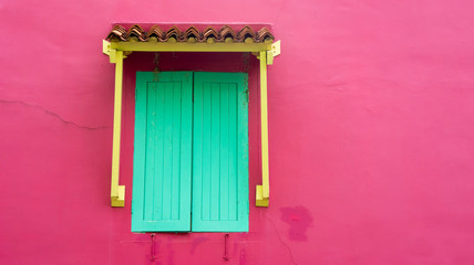 Fototapeta premium old wooden window with vibrant colors