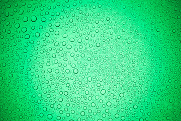 Rain droplets on green glass background, Water drops on glass.