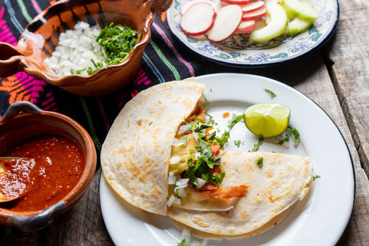 Mexican quesadilla with pork also called "gringa al pastor"