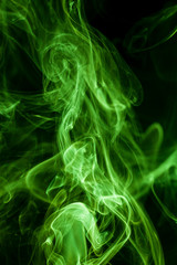 Green smoke movement on black background.