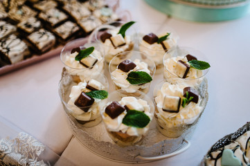 Dessert table for a party. cakes, pie, cupcakes. Colorful table with sweets and goodies for the wedding party reception, decorated dessert table. Delicious sweets on candy buffet.