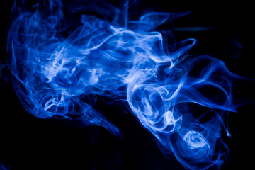 Obraz premium Blue toxic fumes movement on a black background.