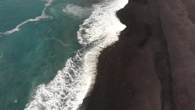 pohoiki bay aka Isaac hale park after recent lava flow, black sand from shattered hot lava has filled in the bay and created a beautiful beach.