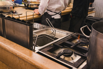 gas stove and deep fryer in the kitchen