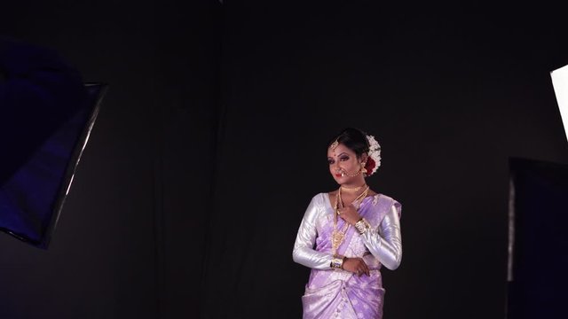 Beautiful Indian young woman posing in traditional dres