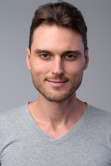 Fototapeta premium Face of handsome man looking at camera