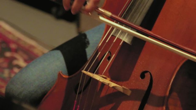 Close up of Musician Play the Cello in Studio