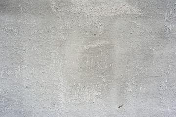 Texture of a concrete wall with cracks and scratches which can be used as a background