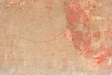 Texture of a concrete wall with cracks and scratches which can be used as a background