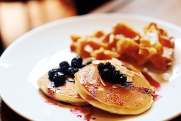 pancakes with berries and honey