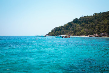 Similan Islands, Andaman Sea, Thailand, March 18, 2018: National park, beautiful blue sea. White boats with tourists.