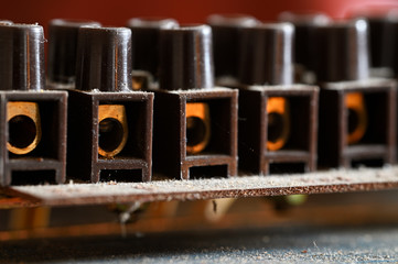 Dusty brown plastic terminal block for wires.