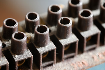 Dusty brown plastic terminal block for wires.