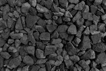 Natural fire ashes with dark grey black coals texture. It is a flammable black hard rock. Space for text.