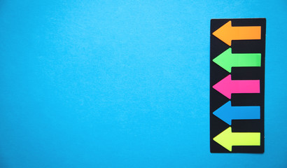 Colorful arrows on blue background.