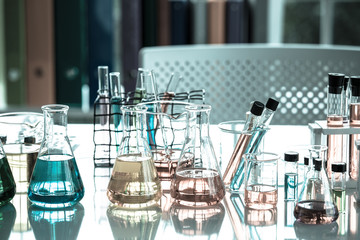 Chemical tube set development and pharmacy in laboratory with green bokeh through windows